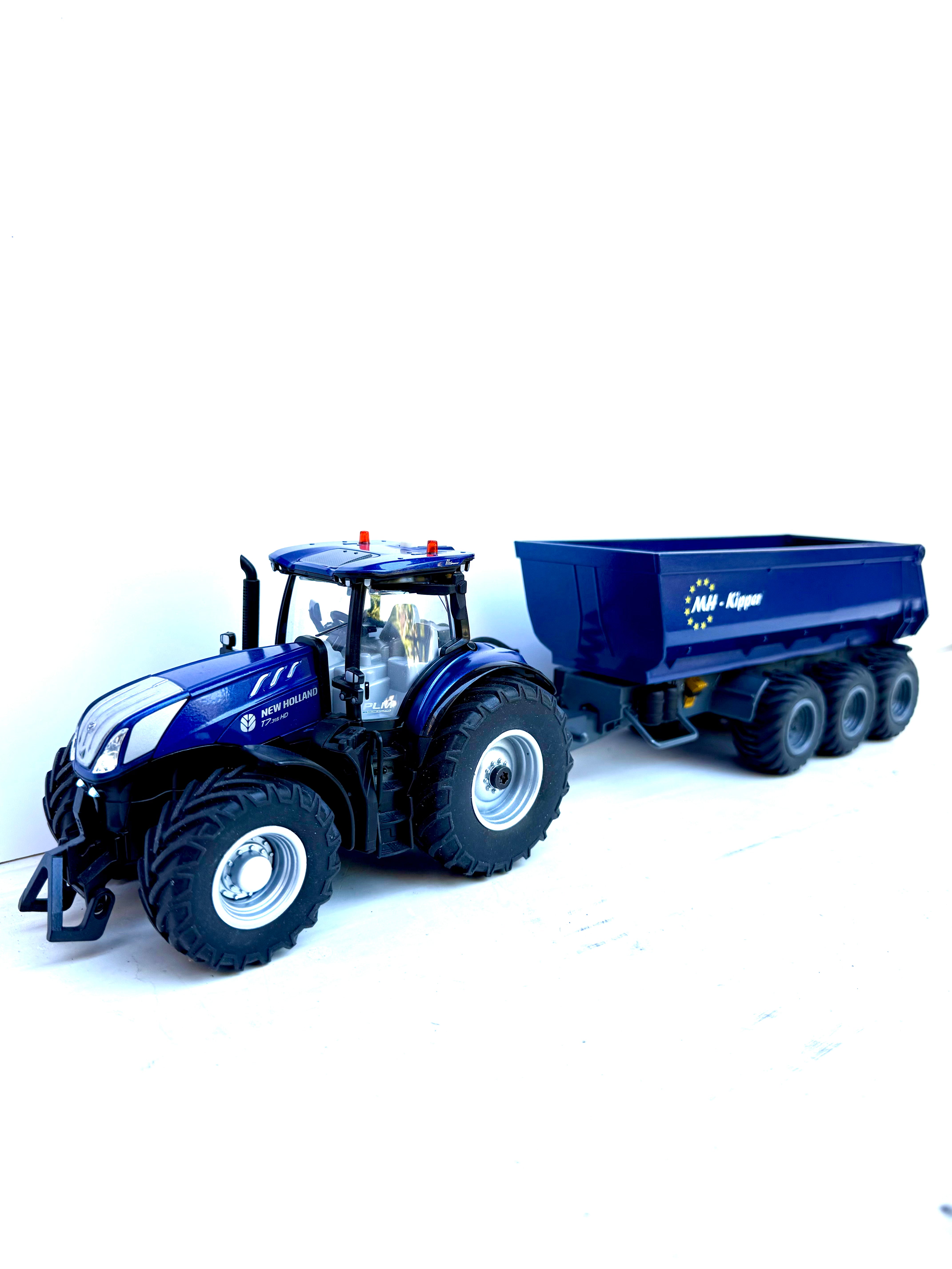 Siku Control 6780 Schmitz Dreiachser Kipper Umbau 1:32 New Holland blau  – erhöhter Kippwinkel