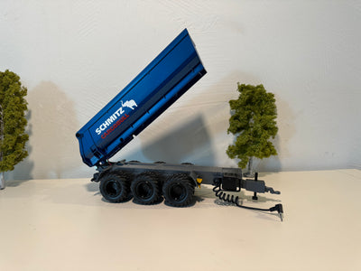 Seitenansicht:
Kipper in blau, Felgen in schwarz
Mulde hoch gekippt