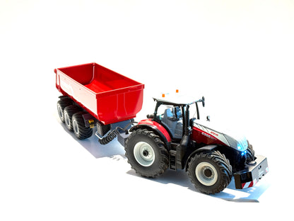 Seitenansicht:
Kipper in rot, Felgen in schwarz, mit Trecker